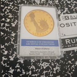 Statue of liberty twenty four k gold Coin....