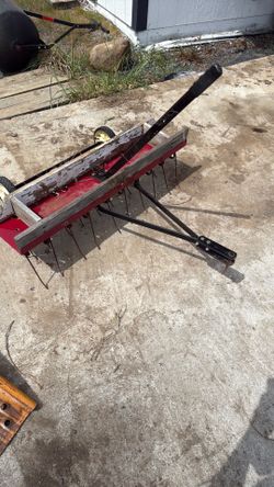 Tow behind lawn dethatcher