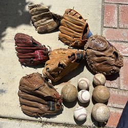 A Group Of Baseball Gloves 