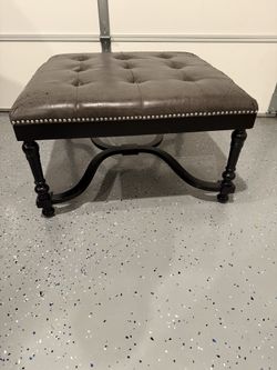 Grey and black leather ottoman