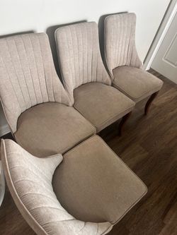 4 beige dining chairs