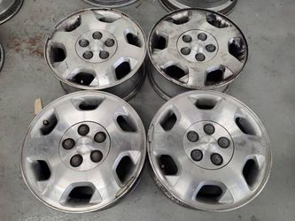 Saturn L series 15 inch wheels and hub caps 5 on 110mm fits Chevy