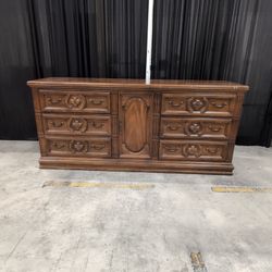 Brown Wood Six-Drawer Dresser with Center Cabinet