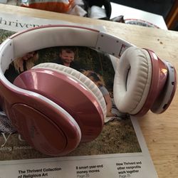 rose colored bluetooth headphones