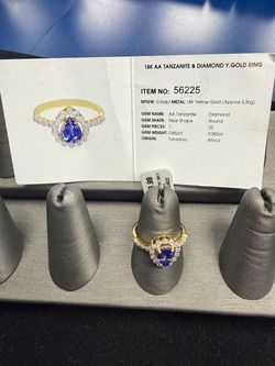 18KT AA Tanzanite & Diamond Ring Pear Shape, MTGW: 0.934xt., Yellow Gold, Appx., 3.36g Size 7