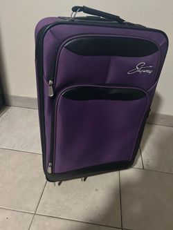 purple Skyway brand suitcase