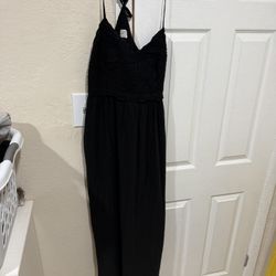 This is a strap dress from Wild Fable, characterized by its open back design and stepped skirt.