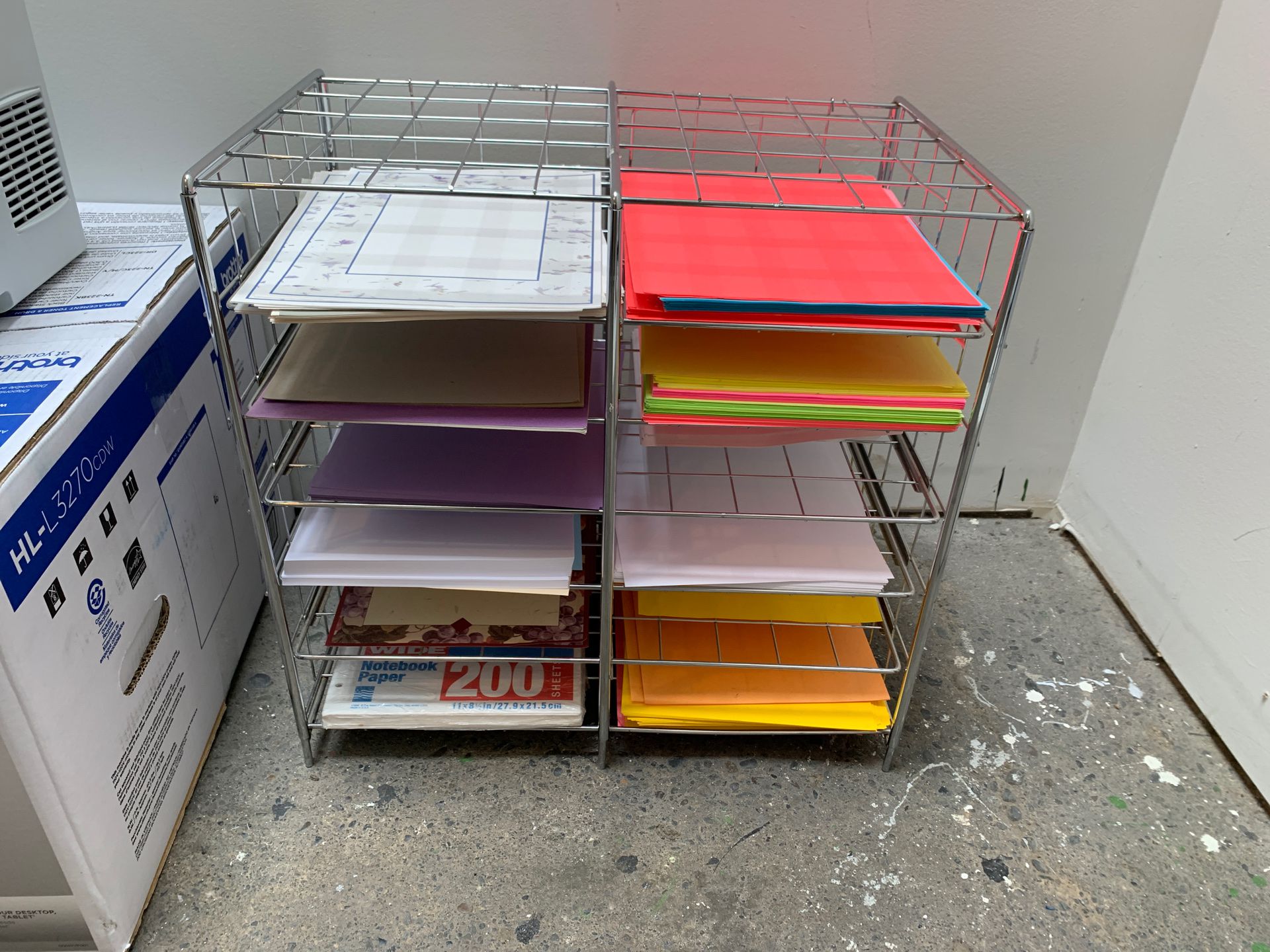 Metal paper organizer shelves with the paper