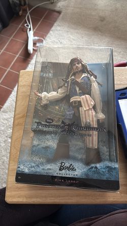 Disney’s Pirates of the Caribbean collectible doll pink label