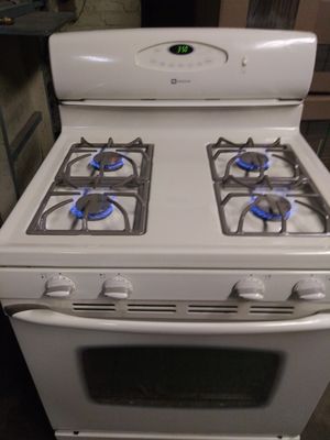 Photo Off-white beige color stove works great free delivery hook up