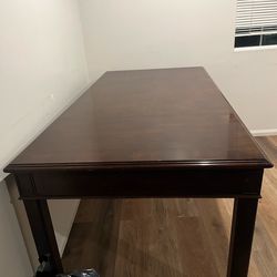 A single-slab wooden table—no chairs.