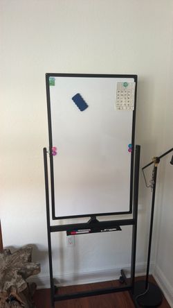 Whiteboard standing with eraser and markers