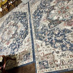 Two distinctive rugs with an antique design