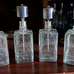 4 GLASS ALCOHOL CANISTERS 