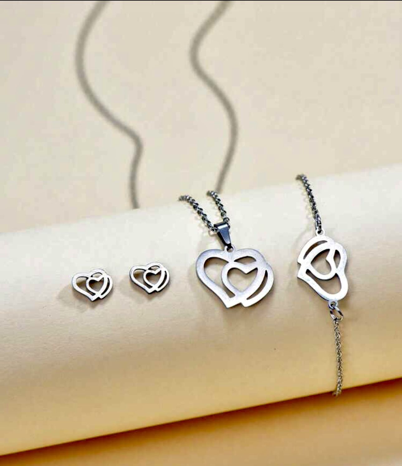 Stainless Steel 4 PCs Heart Pendant Necklace, Stud Earrings And Chain Bracelet 