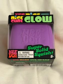 Glow Super Solid Squish Cube in purple.