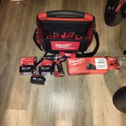 Milwaukee lot / 3 batteries/ 1/2 in. hammer drill/ corded angle grinder/  Milwaukee 15" storage tote