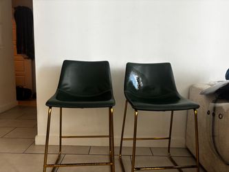 Forest green chairs with gold detailing