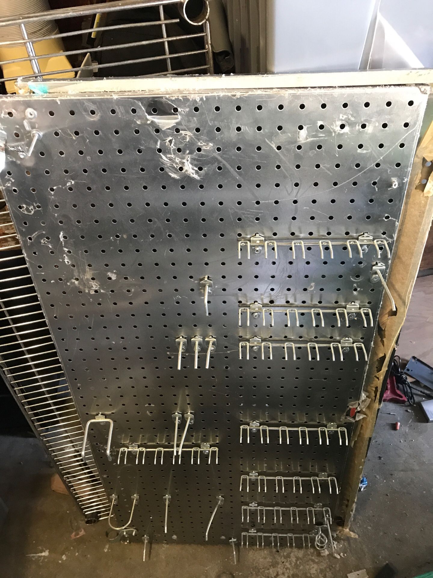 Stainless steel pegboard with random pegs