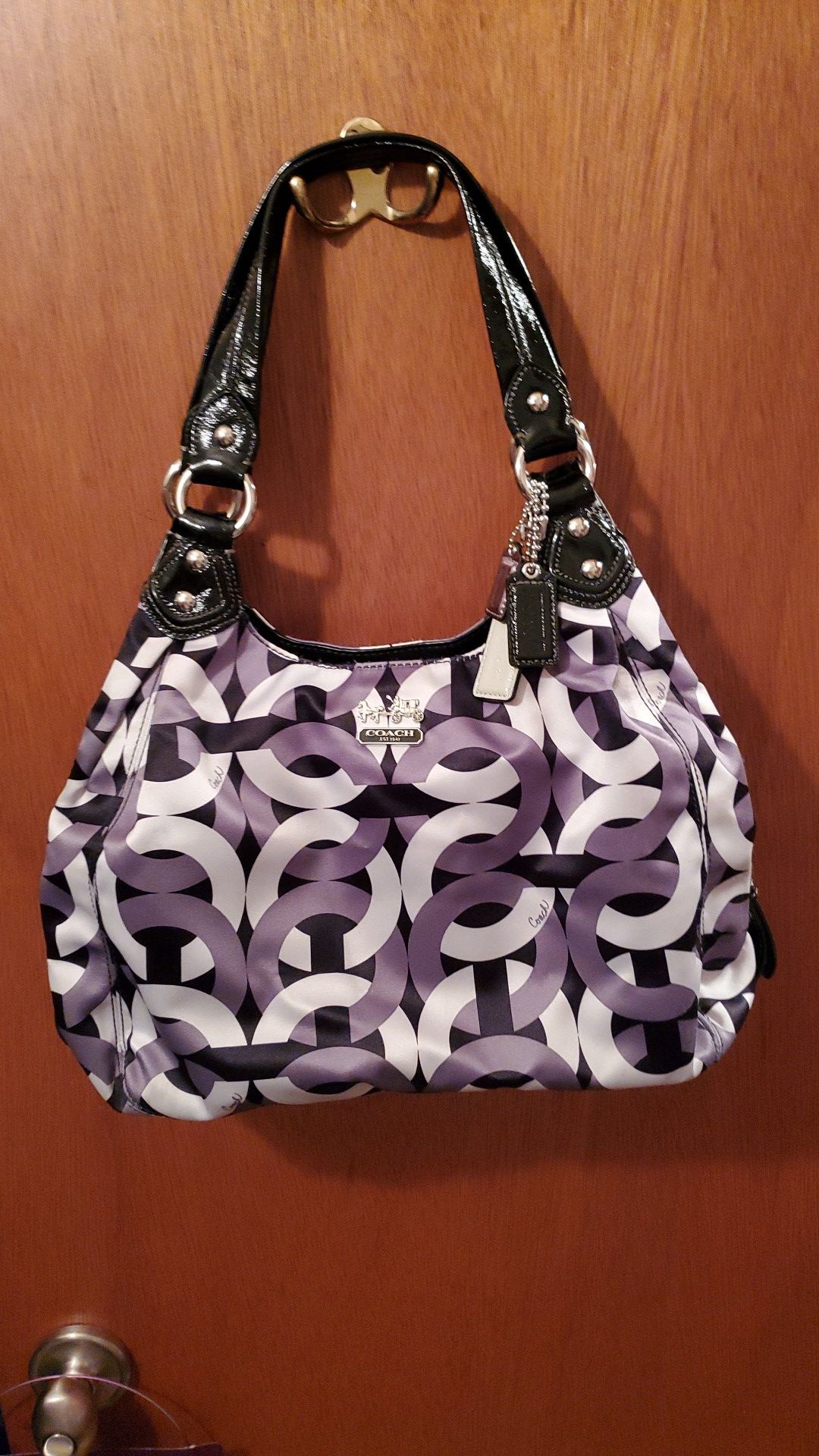 Coach Purse / Color is Gray, White and Black inside is Purple