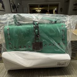 Brand new Bagdley Mischka Green crossbody with the big chain on cover 
