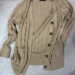 Tan cable knit cardigan with button up front and pockets size medium 