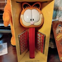 Garfield Large Giant Pez Never Been Out Of The Box $50 Garfield And OD Porcelain Doll Set $200 I Still Have The Papers No Boxes They're Perfect