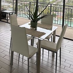 Glass Kitchen Table With Four White Chairs