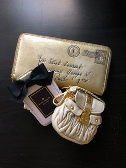 Saint Laurent zippy wallet, Miu Miu coin purse, and Kate Spade coin purse