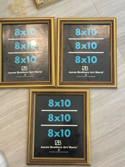 3 gold picture framea