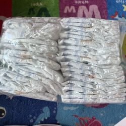 100 Newborn Pampers swaddlers & 30 Newborn Huggies
