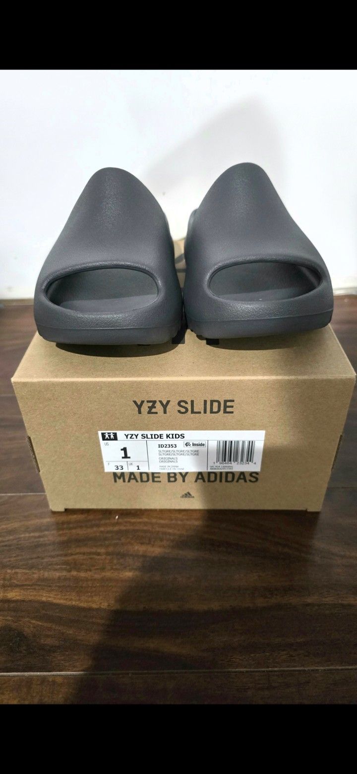Brand new yeezy slide slate grey kids size 1 with box.
