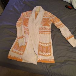 women's orangish/Pinkish and grey Aztec or geometric patterned open-front cardigan. 