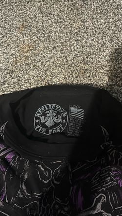 in the color, purple and black size large affliction T-shirt in the color, purple and black size large