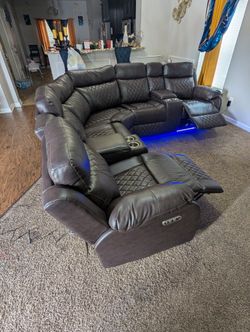 BLACK LEATHER POWERED RECLINER SECTIONAL W/ BLUETOOTH SPEAKER, LED LIGHTS AND USB CHARGING