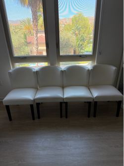 White Faux Leather dining room chairs