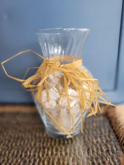 Clear Glass Vase Filled with Sand, Etc. With Raffia Bow