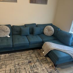 Small L shaped teal couch