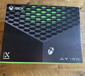 Microsoft Xbox Series X 1TB Video Game Console - Black with controller.