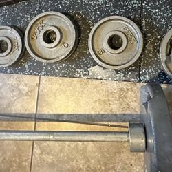 Olympic barbell  And Weights 25 ,  10 , 5 ,2.5 