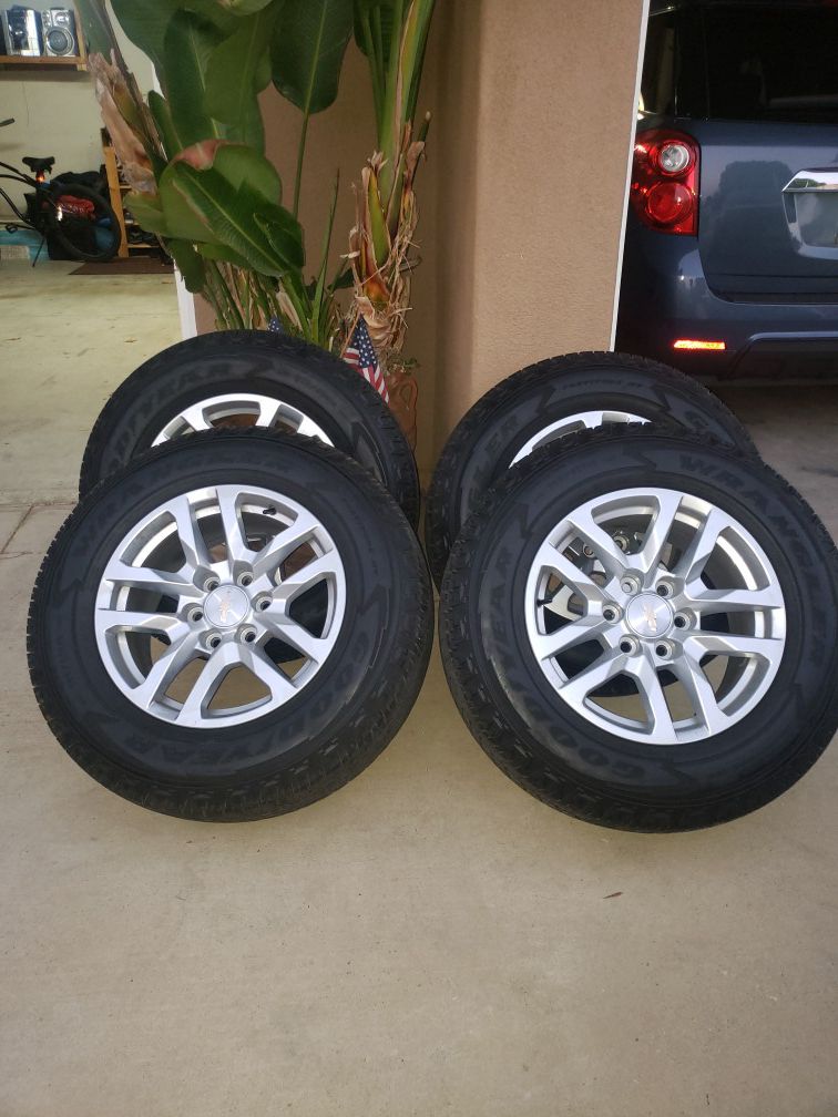 Goodyear Wrangler tires and Chevy rims