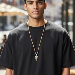 30"Turquoise/Coral Stone Inlay Arrowhead Southwestern Style Pendant Leather Cord. Excellent Condition. This turquoise and coral arrowhead necklace fea