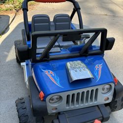 Power Wheels Hot Wheels Jeep Wrangler Battery-Powered Ride-On Toy Vehicle with Music & Sounds, 12V