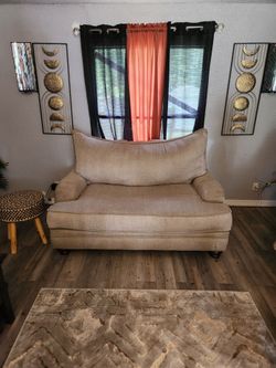 Beige sofa and loveseat