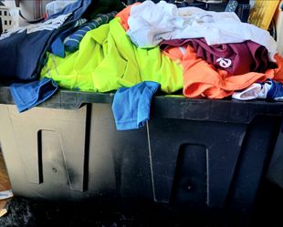 large bin of Mens Clothes