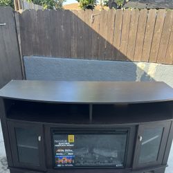 dark brown electric fireplace TV stand with a Spectrafire insert.  60inch