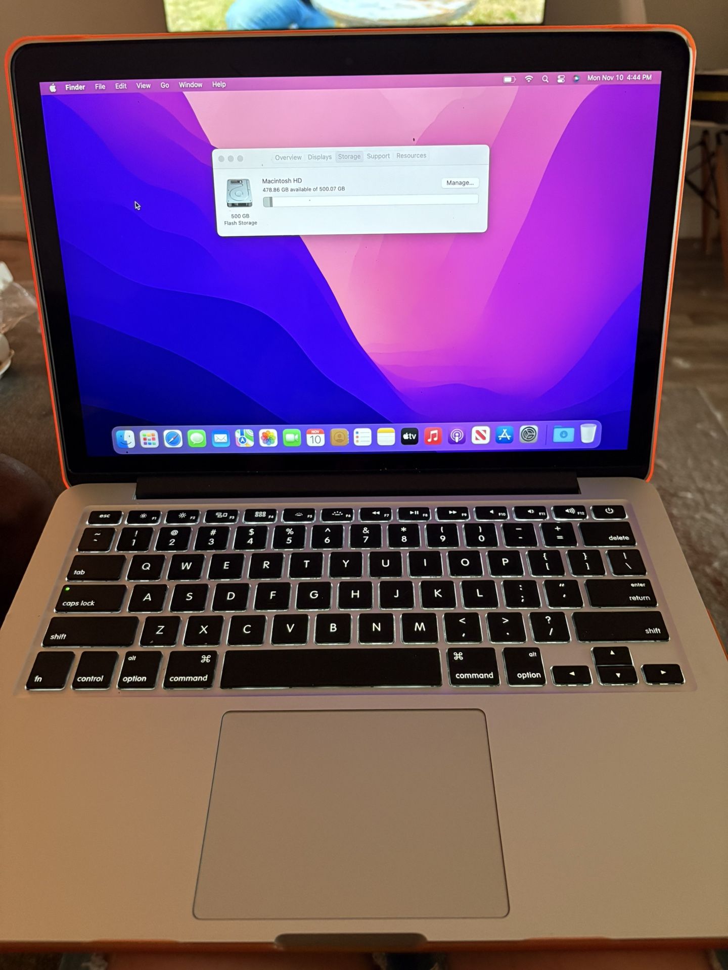 MacBook Pro with case and charger