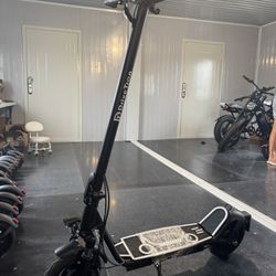 Electric scooter with shock absorption