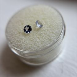 Pair of pale lavender tanzanite round brilliant gemstones