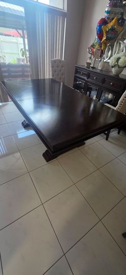 Dark wood tresel dining table